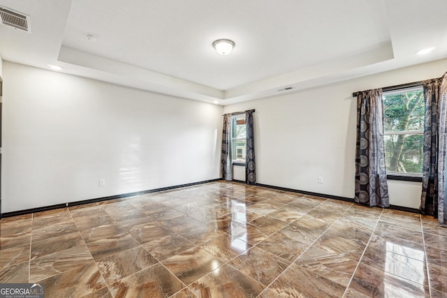 2711 Mcdonough Rd, Hampton, GA 30228 - spare room featuring a raised ceiling, baseboards, marble tiled floors, recessed lighting, and a smoke detector