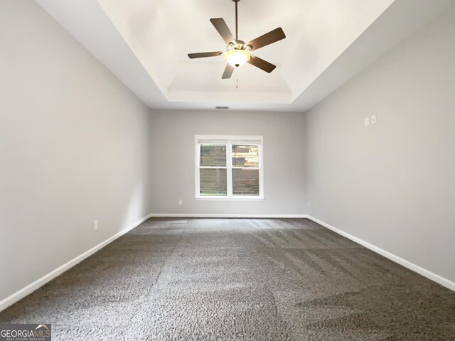 200 Pine Trl, Dallas, GA 30157 - carpeted empty room with a raised ceiling and ceiling fan