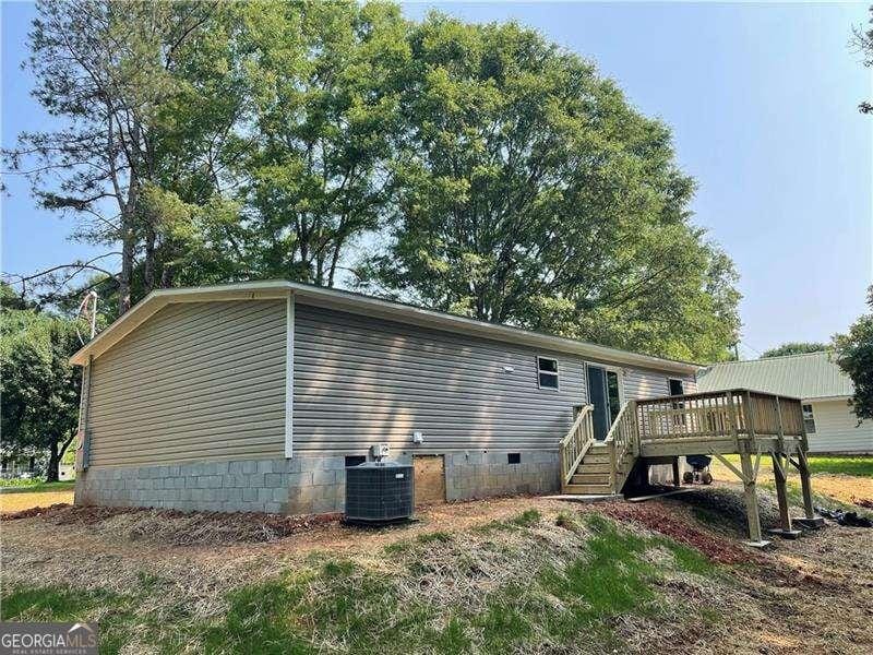 921 Marshall Fuller Rd, Dallas, GA 30157 - back of house featuring a deck, stairway, and crawl space
