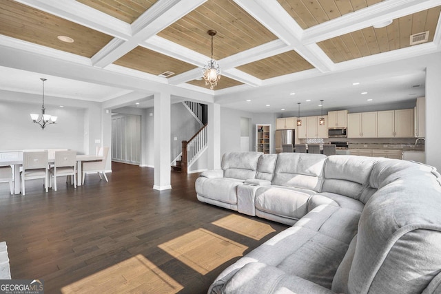 2029 Havenhurst Way, Auburn, GA 30011 - living area featuring a chandelier, coffered ceiling, dark wood-style floors, stairs, and recessed lighting