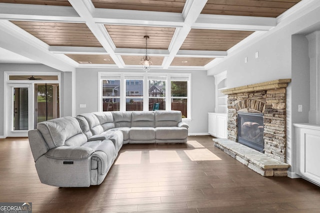 2029 Havenhurst Way, Auburn, GA 30011 - living room featuring dark wood-style flooring, a stone fireplace, beam ceiling, coffered ceiling, and baseboards