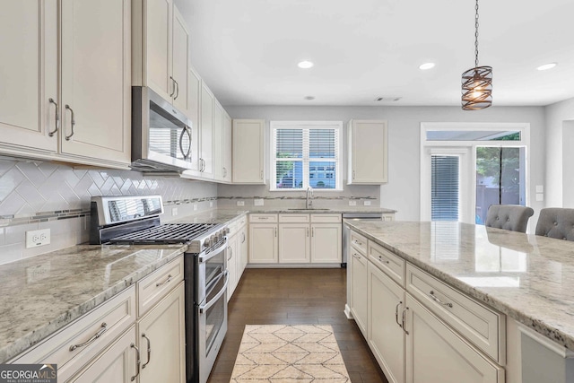 2029 Havenhurst Way, Auburn, GA 30011 - kitchen featuring appliances with stainless steel finishes, a sink, healthy amount of natural light, tasteful backsplash, and recessed lighting