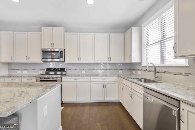 2029 Havenhurst Way, Auburn, GA 30011 - kitchen with stainless steel appliances, a sink, white cabinets, decorative backsplash, and recessed lighting