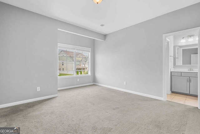 2029 Havenhurst Way, Auburn, GA 30011 - unfurnished bedroom with carpet floors, baseboards, a sink, and ensuite bath