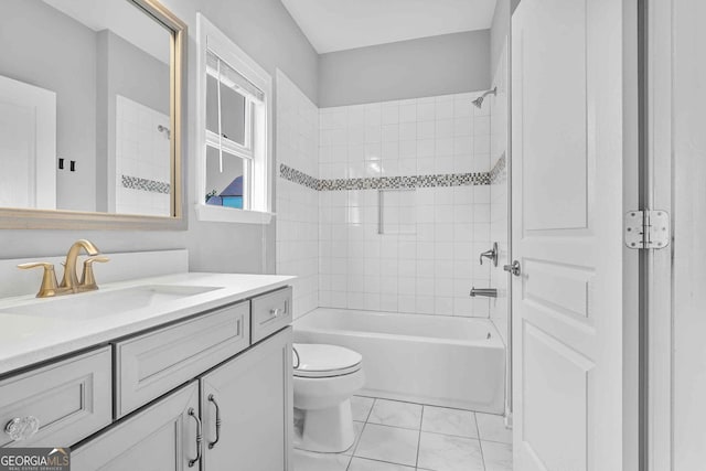 2029 Havenhurst Way, Auburn, GA 30011 - bathroom featuring vanity, toilet, bathing tub / shower combination, and marble look tiles