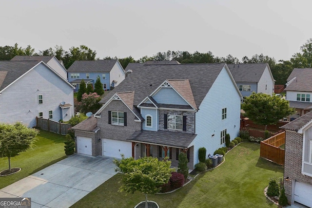 2029 Havenhurst Way, Auburn, GA 30011 - view of front facade featuring driveway, a residential view, roof with shingles, and a garage