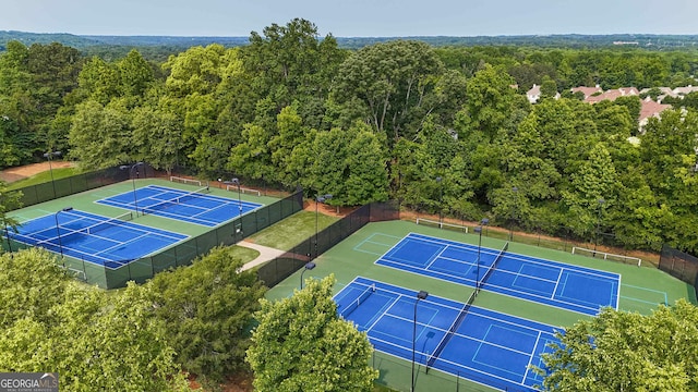 2029 Havenhurst Way, Auburn, GA 30011 - view of tennis court featuring a forest view