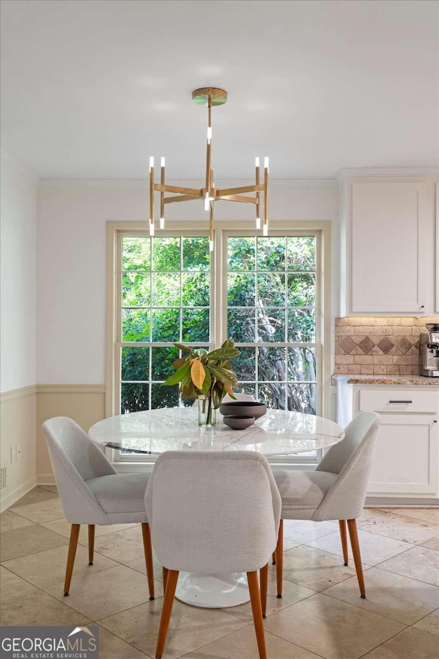 11785 Mountain Laurel Dr, Roswell, GA 30075 - dining area with ornamental molding, a wainscoted wall, and a chandelier