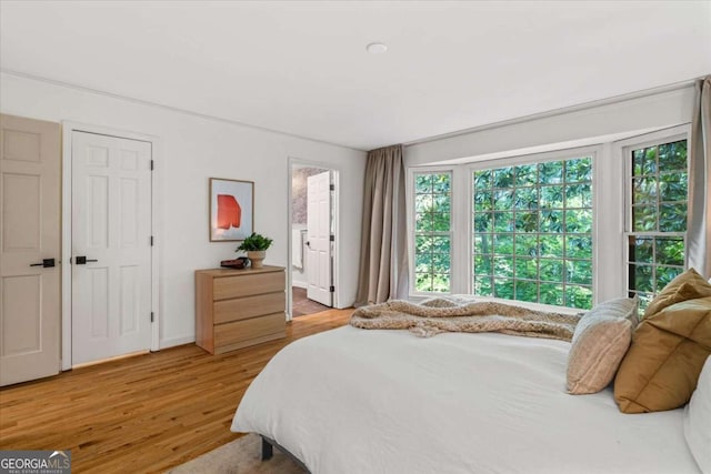 11785 Mountain Laurel Dr, Roswell, GA 30075 - bedroom featuring light wood-style flooring and ensuite bathroom