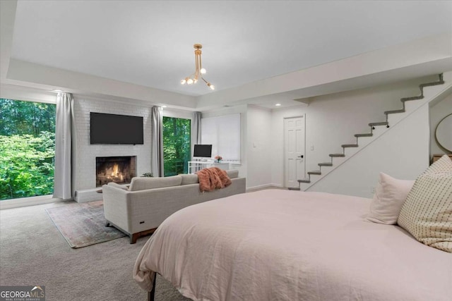 11785 Mountain Laurel Dr, Roswell, GA 30075 - carpeted bedroom featuring multiple windows and a brick fireplace
