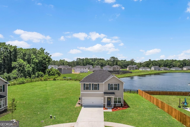 229 Wellspring Ter, Allenhurst, GA 31301 - traditional-style home featuring an attached garage, driveway, and a water view