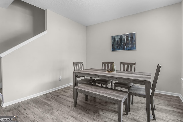 229 Wellspring Ter, Allenhurst, GA 31301 - dining space with baseboards and wood finished floors