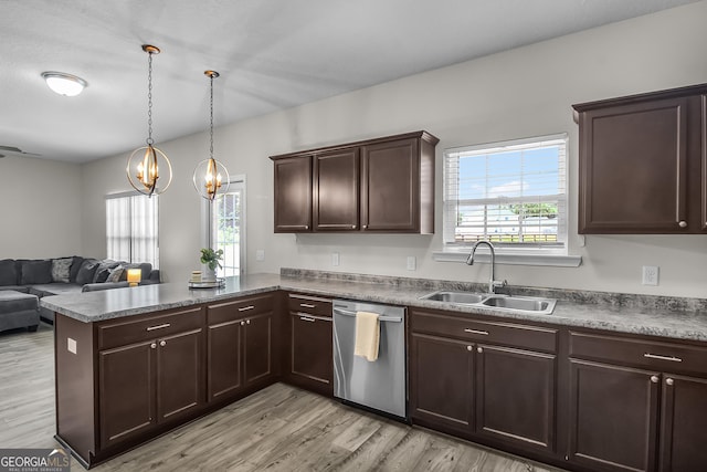 229 Wellspring Ter, Allenhurst, GA 31301 - kitchen with dishwasher, a sink, a peninsula, open floor plan, and light wood-type flooring