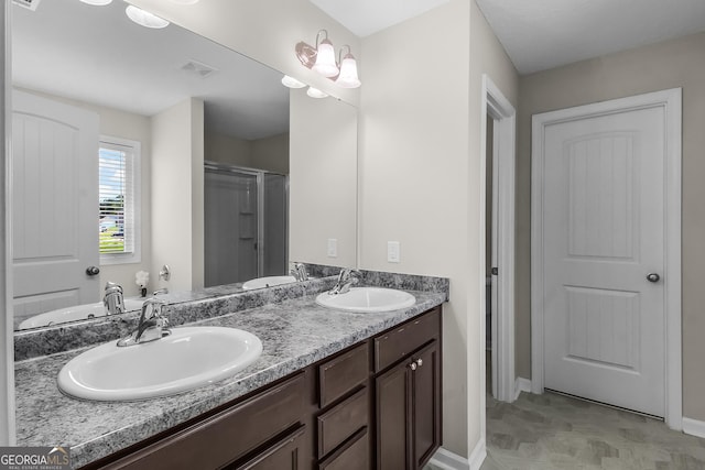 229 Wellspring Ter, Allenhurst, GA 31301 - full bath featuring double vanity, baseboards, and a shower with shower door