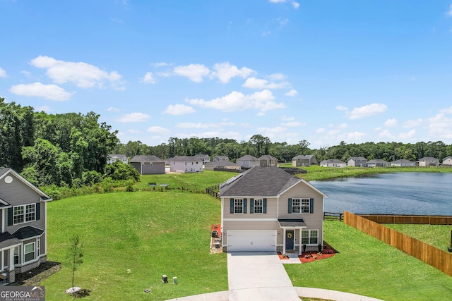 229 Wellspring Ter, Allenhurst, GA 31301 - view of front of home featuring a garage, driveway, a water view, and a residential view