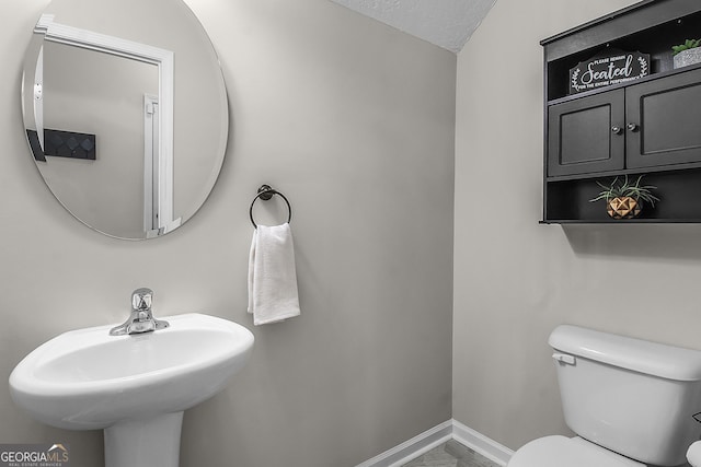 229 Wellspring Ter, Allenhurst, GA 31301 - half bathroom featuring toilet, a sink, and baseboards