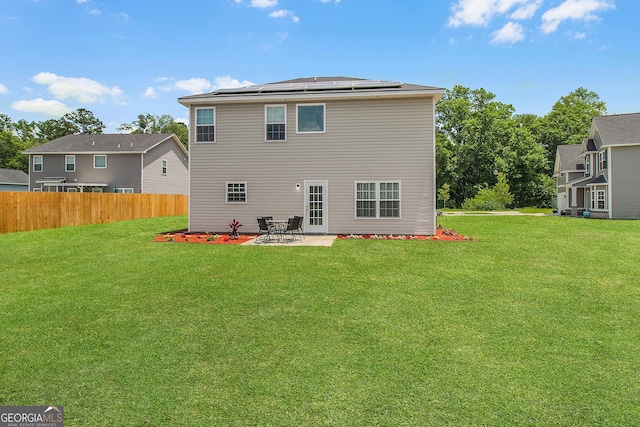 229 Wellspring Ter, Allenhurst, GA 31301 - rear view of house with a patio area and solar panels