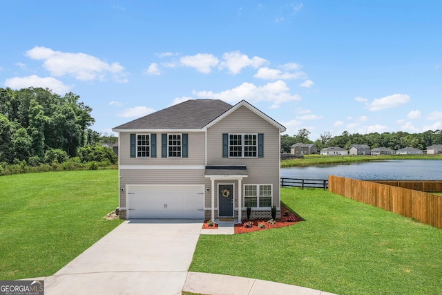 229 Wellspring Ter, Allenhurst, GA 31301 - traditional home with an attached garage, concrete driveway, and a water view