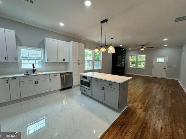 1766 W Lyle Ave, College Park, GA 30337 - kitchen with a sink, appliances with stainless steel finishes, light countertops, recessed lighting, and decorative backsplash