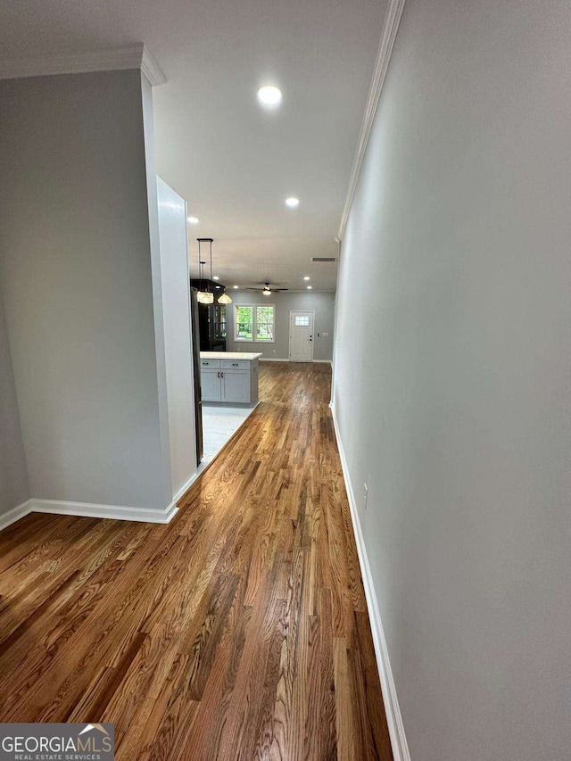 1766 W Lyle Ave, College Park, GA 30337 - hallway featuring crown molding, wood finished floors, baseboards, and recessed lighting