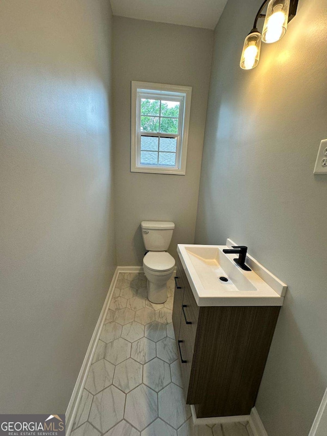 1766 W Lyle Ave, College Park, GA 30337 - bathroom featuring vanity, toilet, baseboards, and tile patterned floors