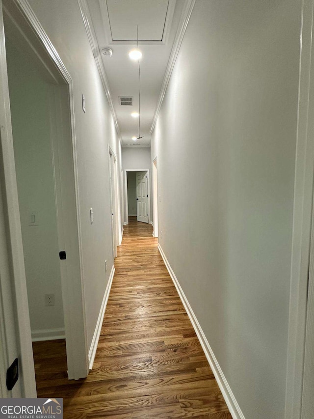 1766 W Lyle Ave, College Park, GA 30337 - hallway with wood finished floors, attic access, ornamental molding, and baseboards