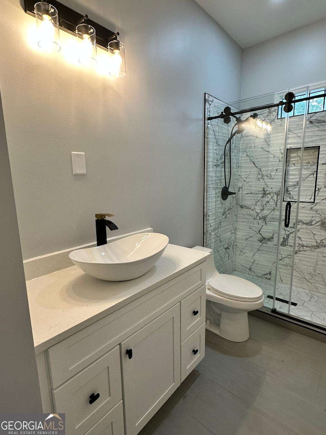 1766 W Lyle Ave, College Park, GA 30337 - bathroom with a marble finish shower, vanity, toilet, and tile patterned floors