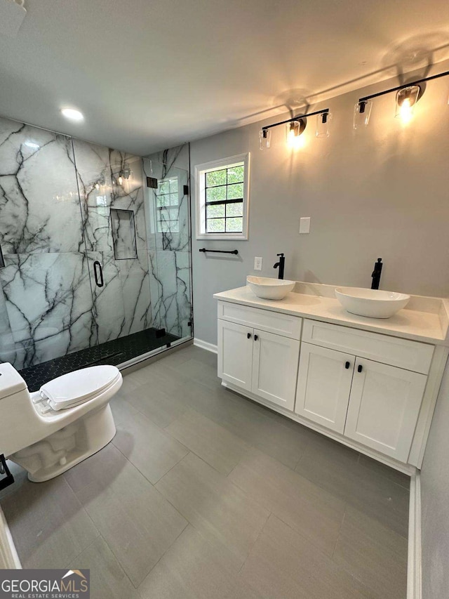 1766 W Lyle Ave, College Park, GA 30337 - full bathroom featuring a marble finish shower, toilet, and double vanity