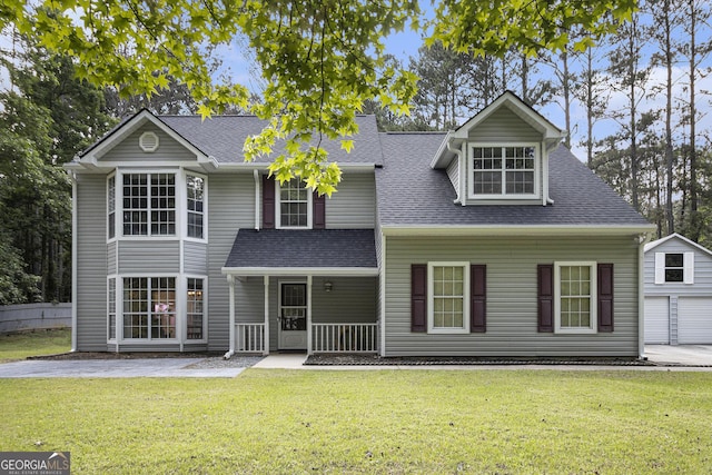40 Briarwood Ln, Newnan, GA 30265 - traditional-style house featuring a porch, a front yard, a shingled roof, and an outdoor structure