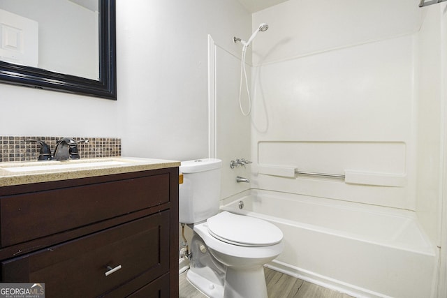 40 Briarwood Ln, Newnan, GA 30265 - full bath featuring tub / shower combination, vanity, wood finished floors, toilet, and backsplash