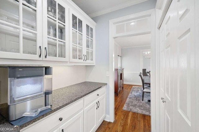 1121 Vinings Grove Way SE, Smyrna, GA 30082 - bar featuring dark wood-style floors and crown molding