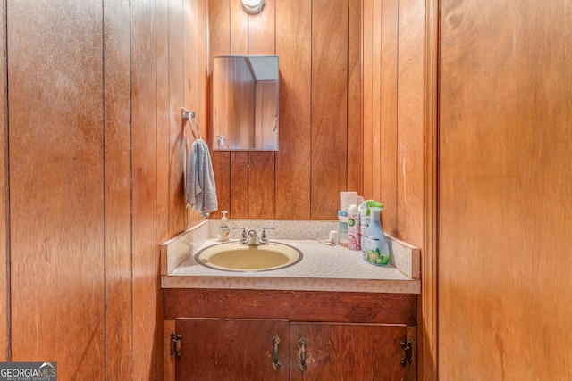 308 E 20th St SW, Rome, GA 30161 - bathroom featuring vanity and wood walls
