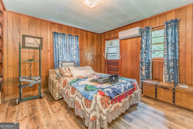 308 E 20th St SW, Rome, GA 30161 - bedroom with a wall mounted air conditioner, wood finished floors, and wood walls