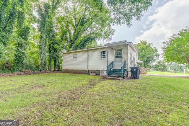 308 E 20th St SW, Rome, GA 30161 - rear view of house featuring entry steps and a yard