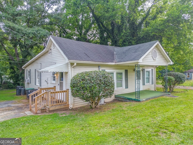 308 E 20th St SW, Rome, GA 30161 - view of side of home featuring a shingled roof and a yard