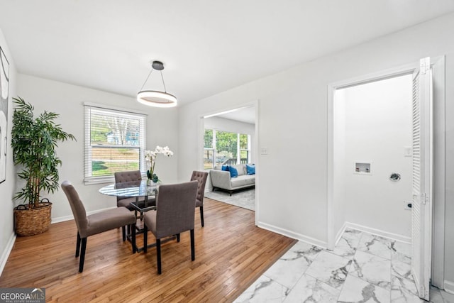 801 N Evelyn Pl NW, Atlanta, GA 30318 - dining space featuring light marble finish floors and baseboards