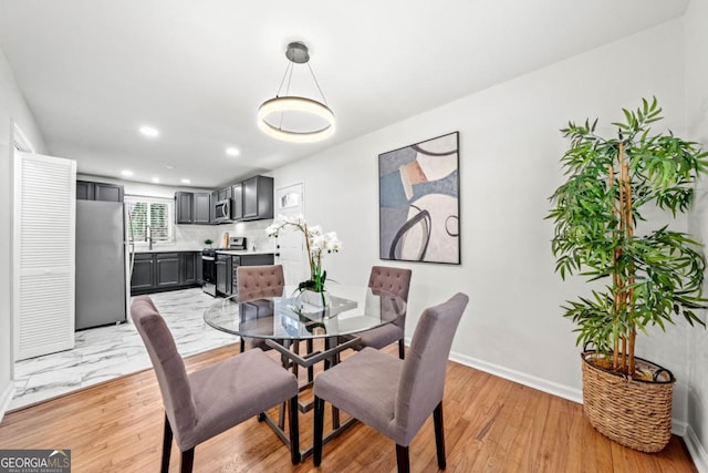 801 N Evelyn Pl NW, Atlanta, GA 30318 - dining area with light wood-style flooring and recessed lighting