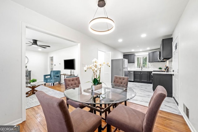 801 N Evelyn Pl NW, Atlanta, GA 30318 - dining room with light wood finished floors, recessed lighting, and a ceiling fan