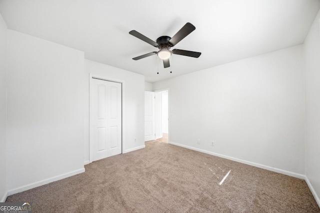 801 N Evelyn Pl NW, Atlanta, GA 30318 - unfurnished bedroom with carpet, a closet, and ceiling fan