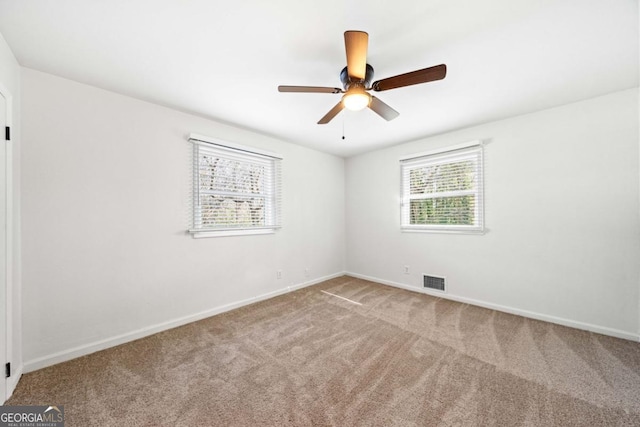 801 N Evelyn Pl NW, Atlanta, GA 30318 - carpeted spare room featuring baseboards and ceiling fan