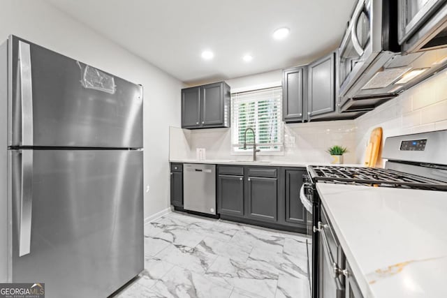 801 N Evelyn Pl NW, Atlanta, GA 30318 - kitchen with stainless steel appliances, light marble finish floors, recessed lighting, light countertops, and gray cabinetry