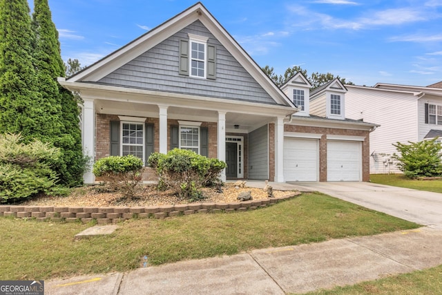 4044 Amberleigh Trce, Gainesville, GA 30507 - view of front of home with brick siding, a front lawn, concrete driveway, and covered porch