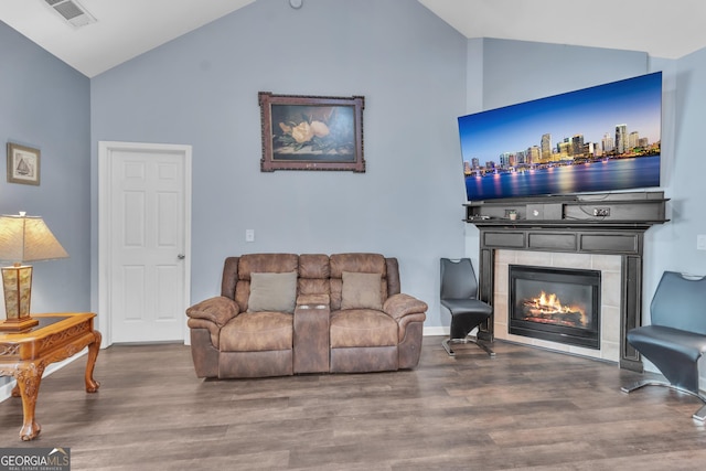 4044 Amberleigh Trce, Gainesville, GA 30507 - living room with high vaulted ceiling, a tiled fireplace, and wood finished floors