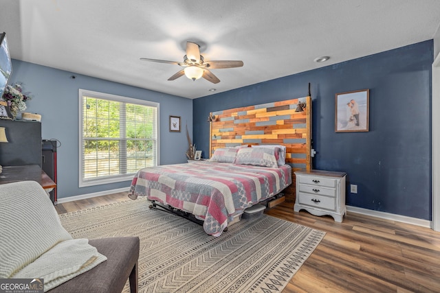 392 Pine Trl, Dahlonega, GA 30533 - bedroom with wood finished floors, baseboards, and ceiling fan