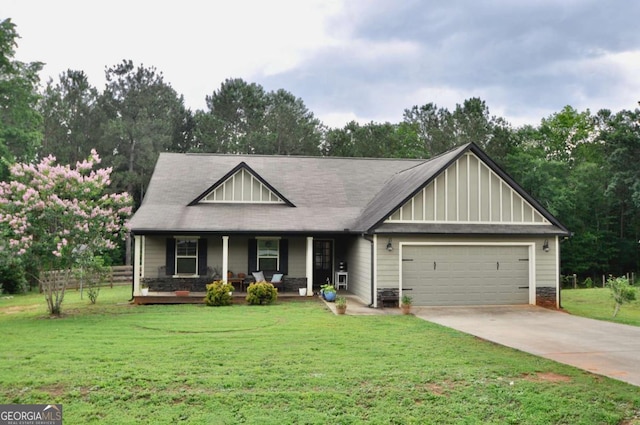 1040 Matthew Ln, Madison, GA 30650 - view of front of house with an attached garage, a porch, a front lawn, and concrete driveway