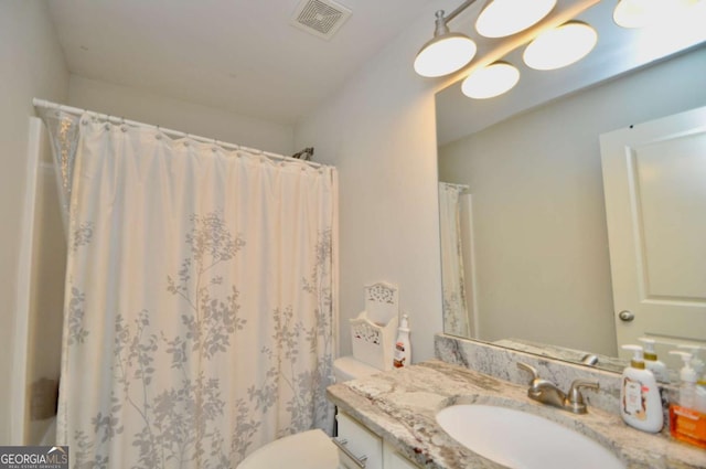 1040 Matthew Ln, Madison, GA 30650 - bathroom with vanity, toilet, and a shower with curtain