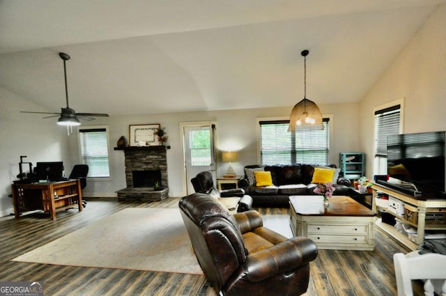 1040 Matthew Ln, Madison, GA 30650 - living area with vaulted ceiling, healthy amount of natural light, wood finished floors, ceiling fan, and a stone fireplace