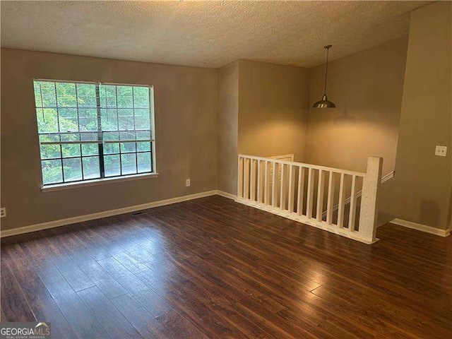3674 Riverchase Ter, Decatur, GA 30034 - empty room with hardwood / wood-style flooring, baseboards, and a textured ceiling