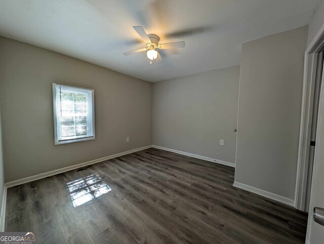 809 S 9th St, Griffin, GA 30224 - unfurnished room featuring dark wood finished floors, a ceiling fan, and baseboards