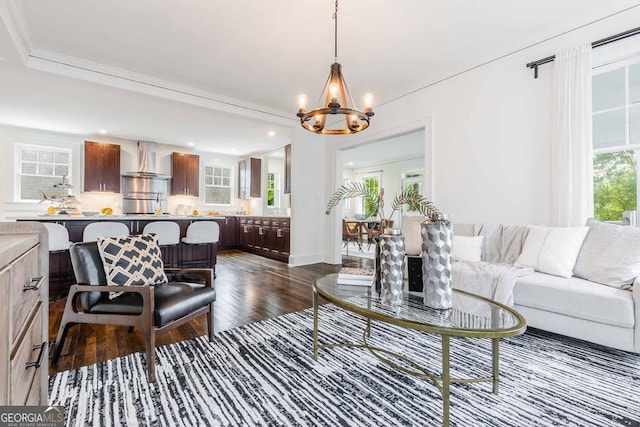 937 Rosedale Rd NE, Atlanta, GA 30306 - living room featuring dark wood-style flooring, a chandelier, crown molding, and recessed lighting